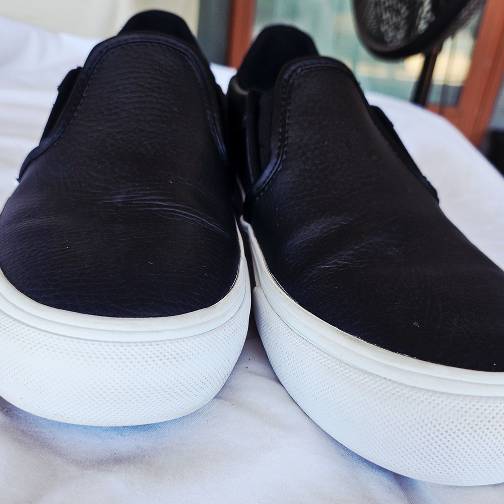 Vans Women's Black and White Slip-On Sneakers